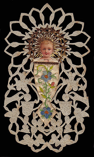 Bambino with birds hand cut and ornamented 1800s France copy.jpg